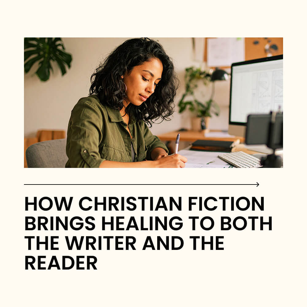 A woman writing in a notebook beside her Bible, with soft morning light coming through a window.